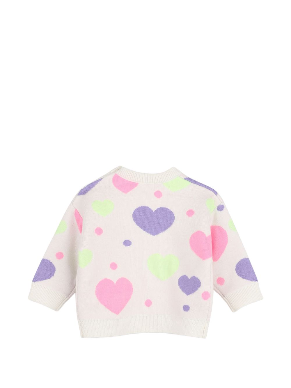 Completo in maglia due pezzi con maglione a maniche lunghe con cuori in jacquard, scollo tondo, chiusura con bottoni sulla spalla. Ampio pantaloni in maglia, vita elastica. U22611 121 BILLIE BLUSH KIDS