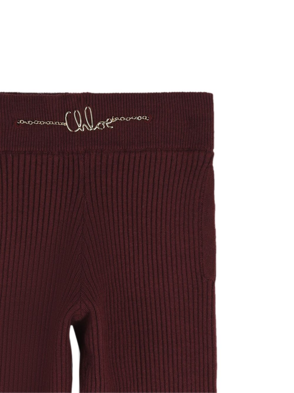 In maglia pantaloni containing 80% of cotton from organic farming e 20% cashmere, side seam tasche, elastico fondo legs e cintura embellished con handwritting chloe metal logo chain on davanti. C21261 94E CHLOE KIDS