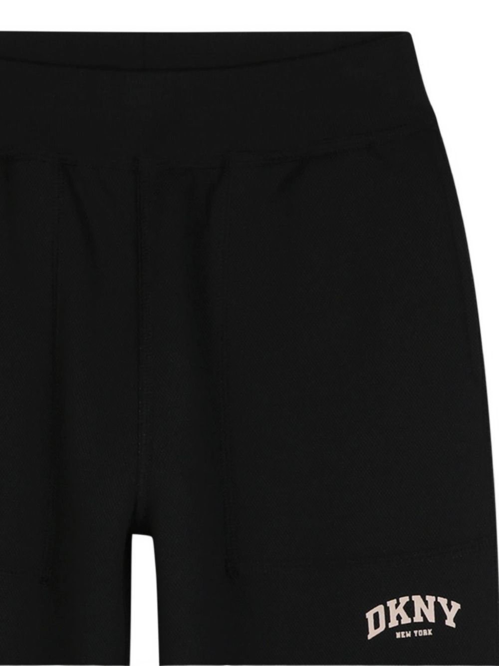 Reversible pantaloni in doble jersey, 86% polyester 10% viscose 4% elastane. One black side in jersey piqué effect con tasche e printed dkny logo. Other side in beige jersey con davanti tasche e printed dkny logo. D62866 P90 DKNY KIDS