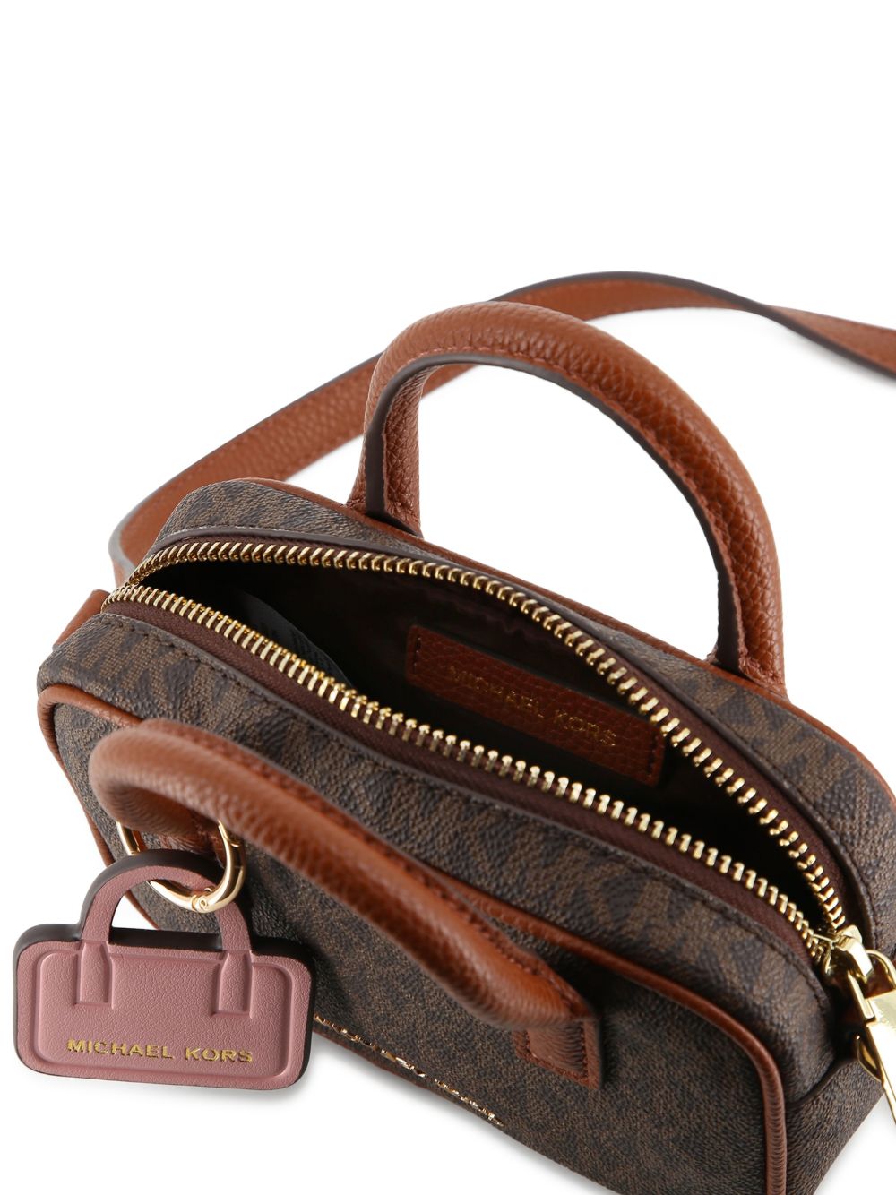 Handbag in monogram grained simili e grained simili con its removable bag key charm. Branded metal plate. Regolabile spalla strap in grained simili con gold buckles. Branded metal zip chiusura. Dimensions : 15x10x4.5cms. R30817 340 MICHAEL KORS KIDS