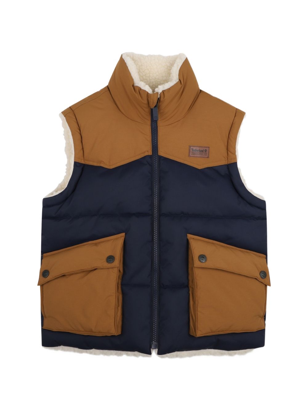 Reversible senza maniche piumino. One side in 100% polyester water repellent twill, bicolor yokes, davanti flap tasche, printed logo on paper label on chest. Other side in 100% polyester faux shearling, side tasche, ricamato logo sul retro. *reversib T61059 849 TIMBERLAND KIDS