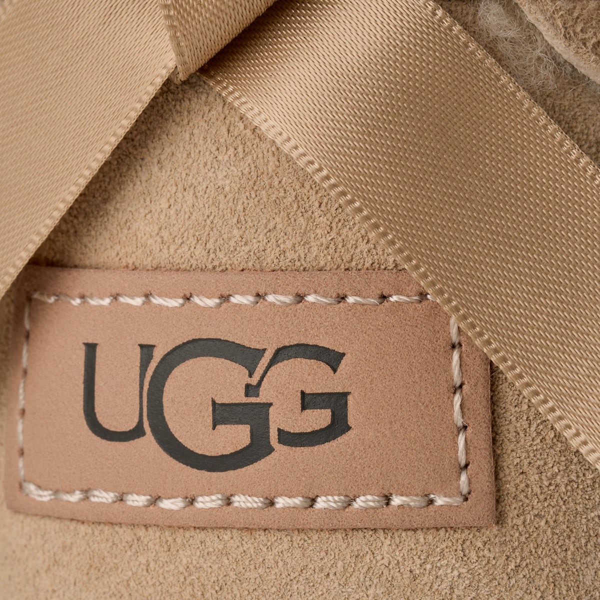 Stivaletti con fiocco beige 1185491 SAN UGG