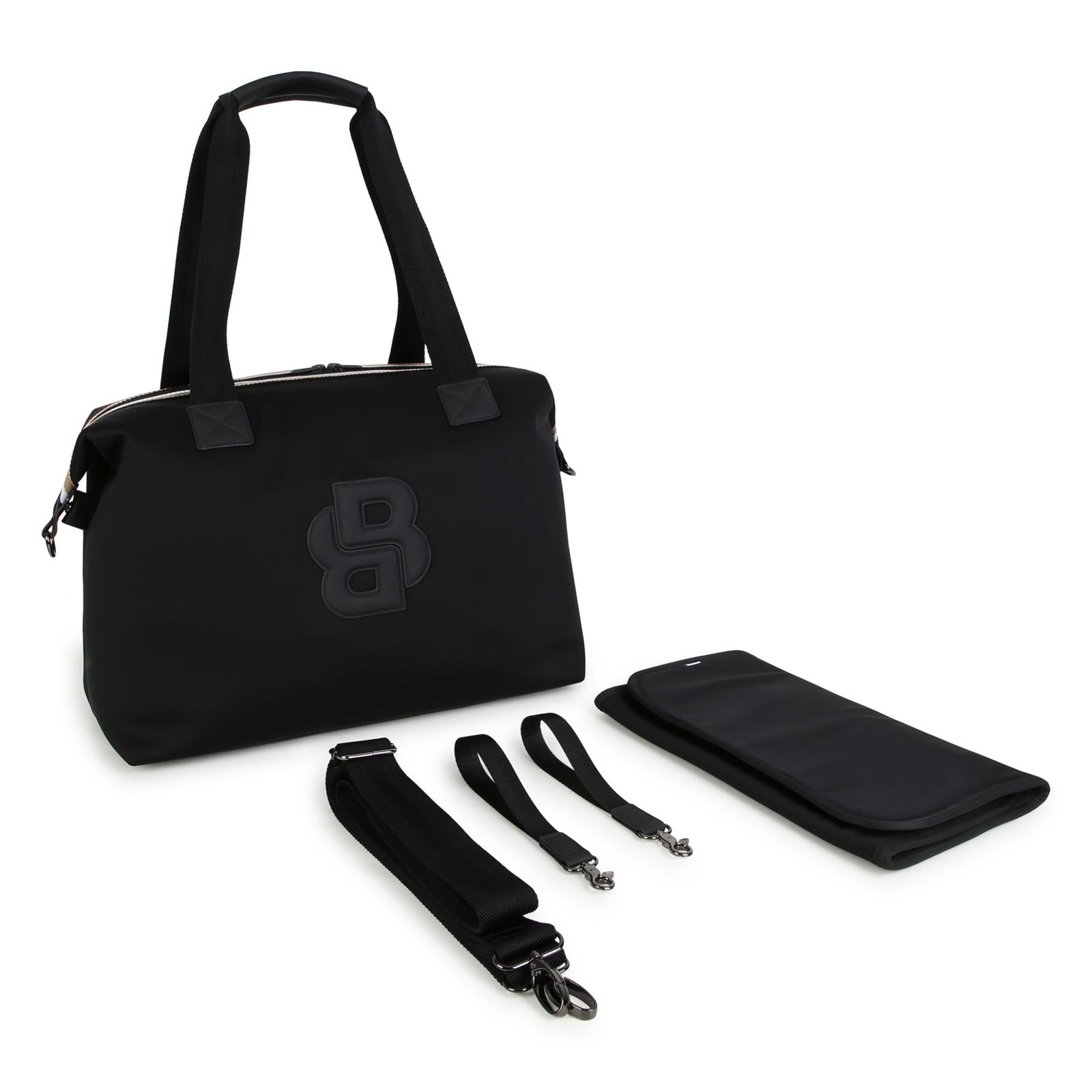 Changing bag in matt thick fabric e gum effect simili (in details). Double b in coated fabric gum effect con relief. Branded stampa on retro. Changing mat + 2 stroller straps + removable strap e handles in textured jacquard. Large tasche on retro. In J53560 09B BOSS KIDSWEAR