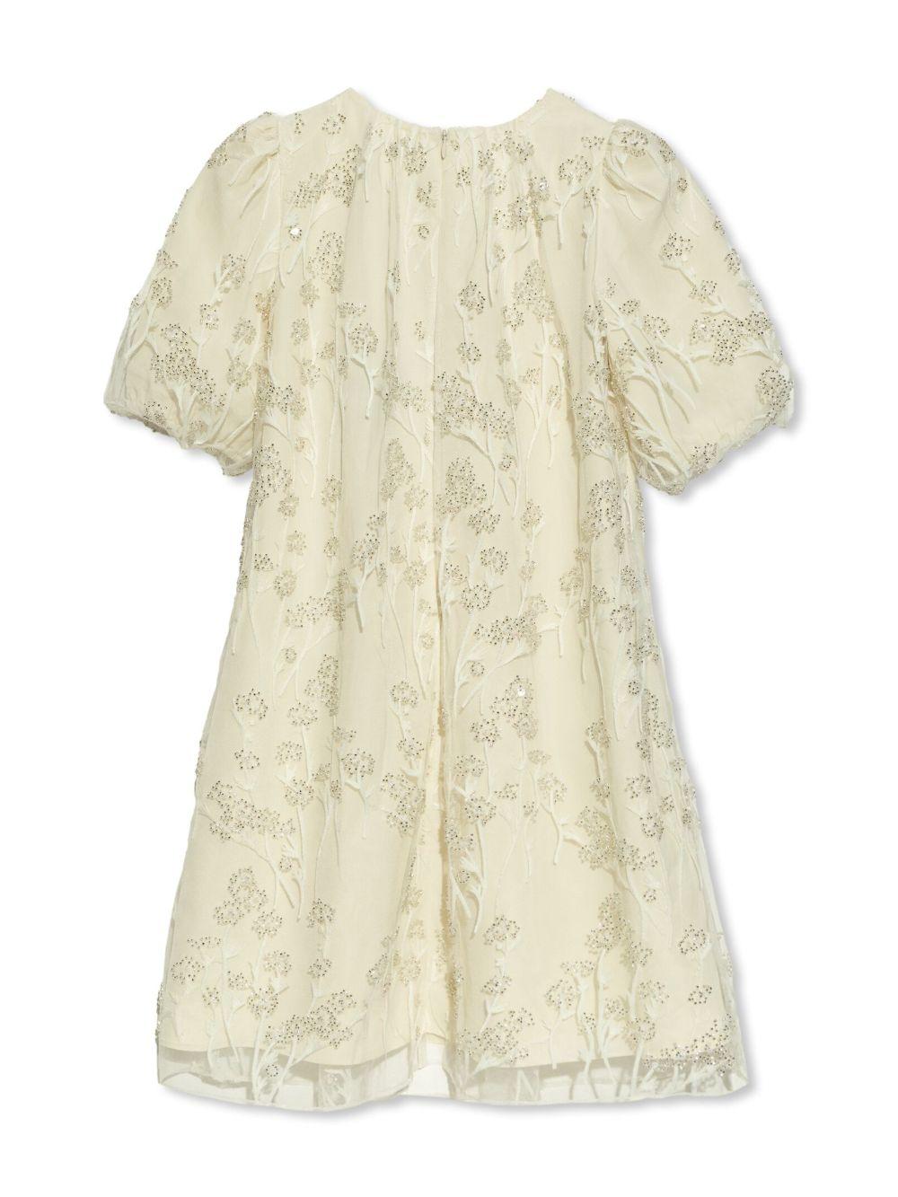 Abito crema in tulle e macramè