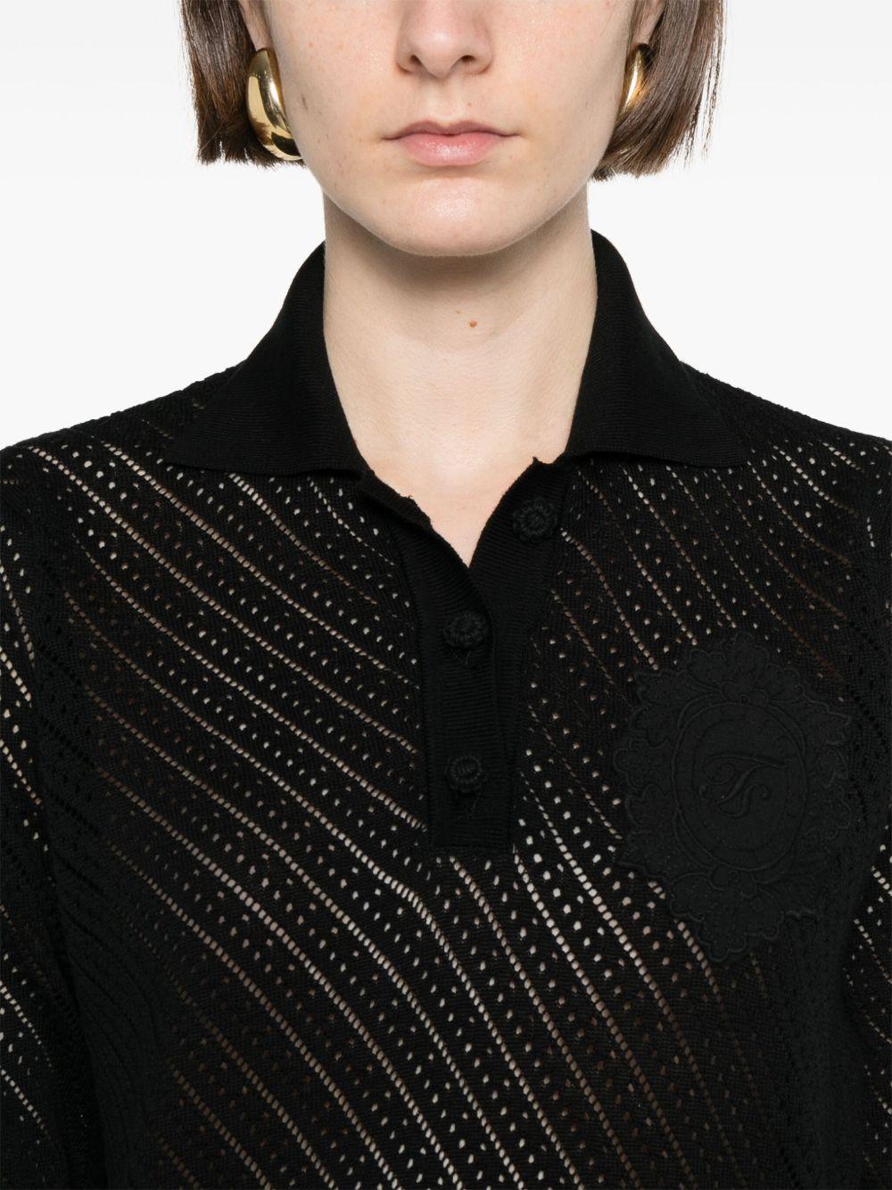 Maglia nera traforata con ricamo