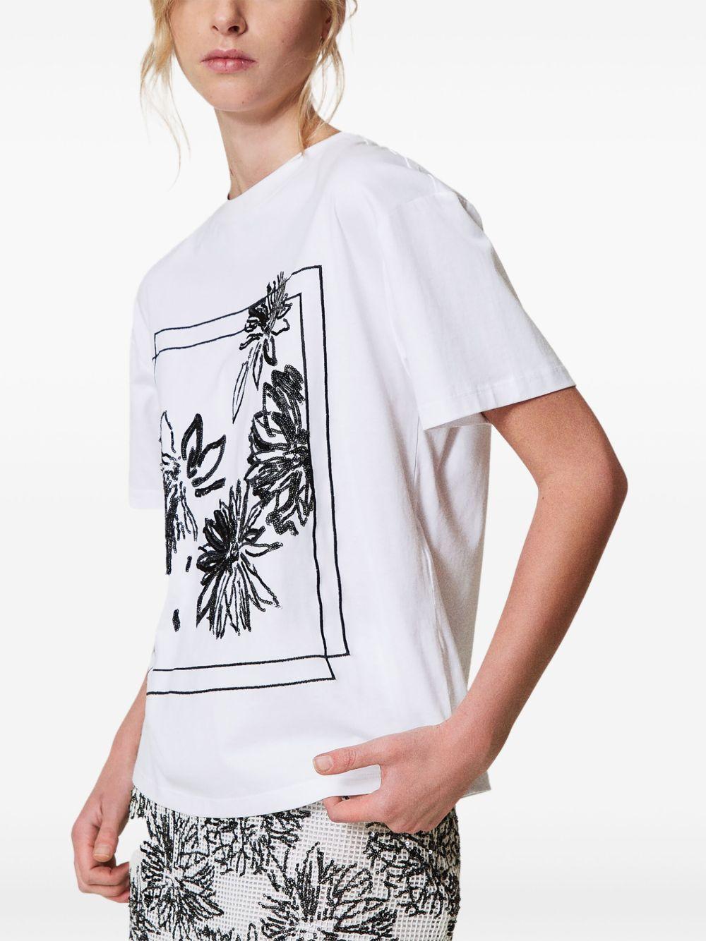 T-shirt bianca con ricami in pailletes
