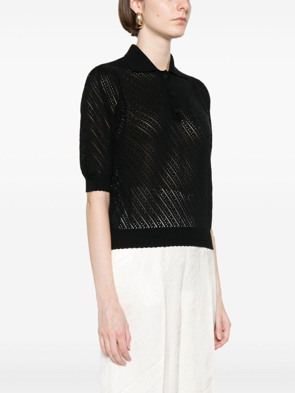 Maglia nera traforata con ricamo