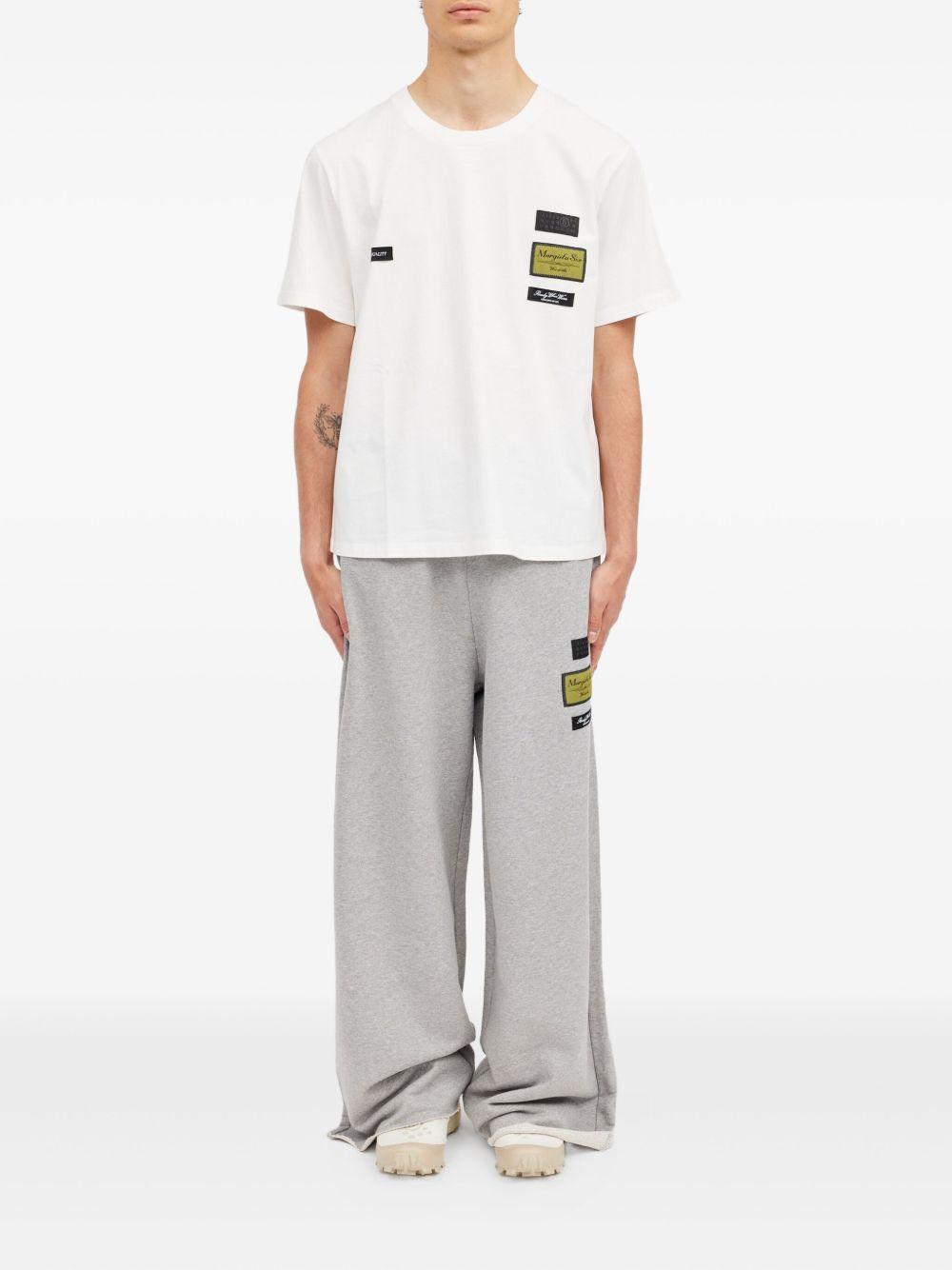 T-shirt in cotone con patch applicate SH0GC0069S24311 101 MM6 MAISON MARGIELA