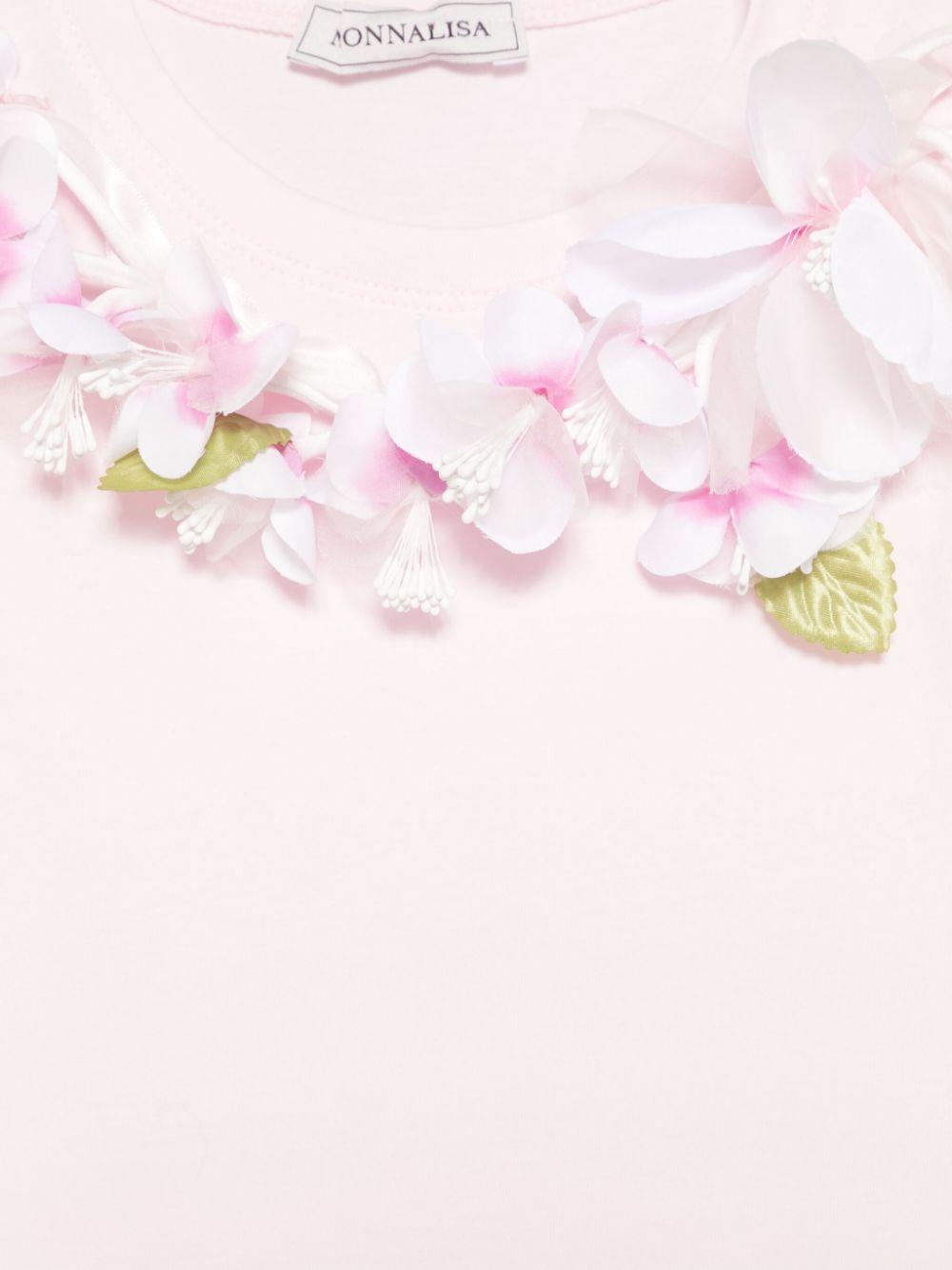 T-shirt rosa con applicazione floreale