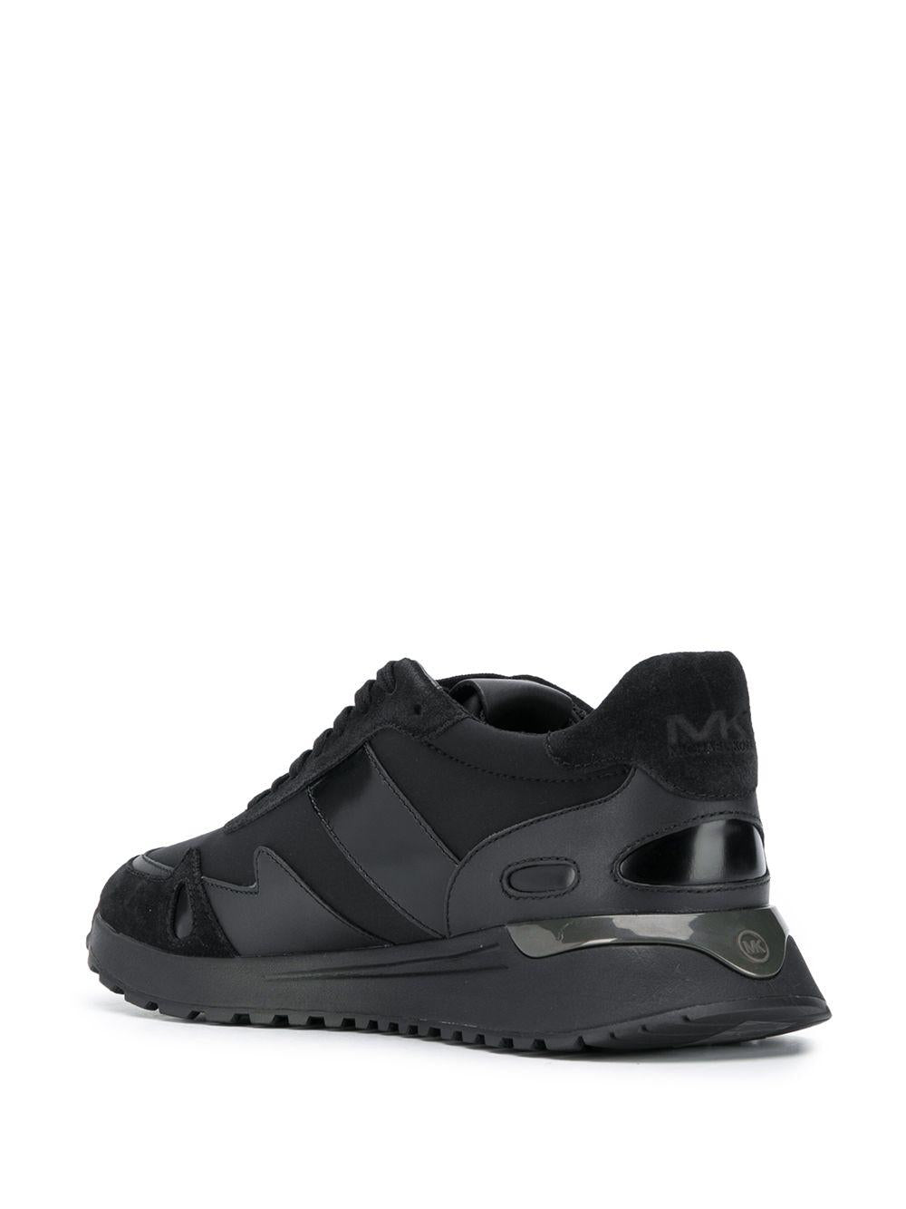 Sneakers nera inserti in pelle e tessuto