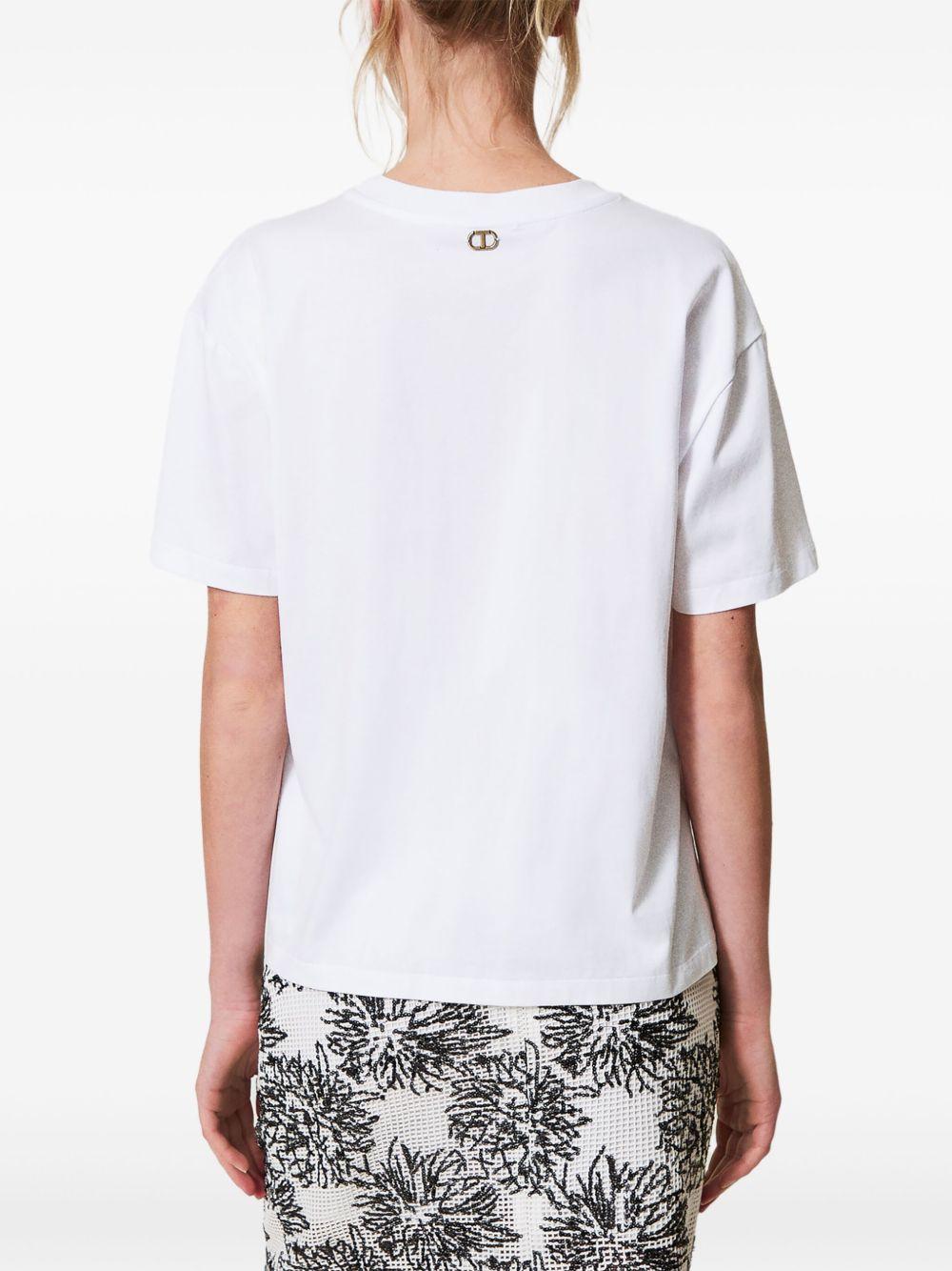 T-shirt bianca con ricami in pailletes