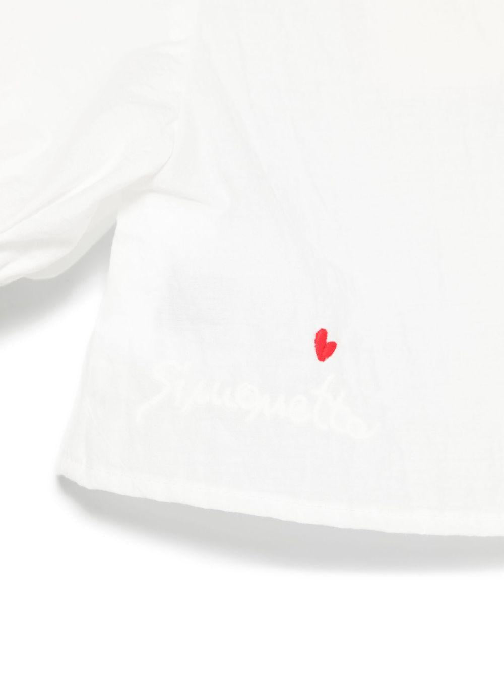 Top bianco neonata con chiusura bottoni