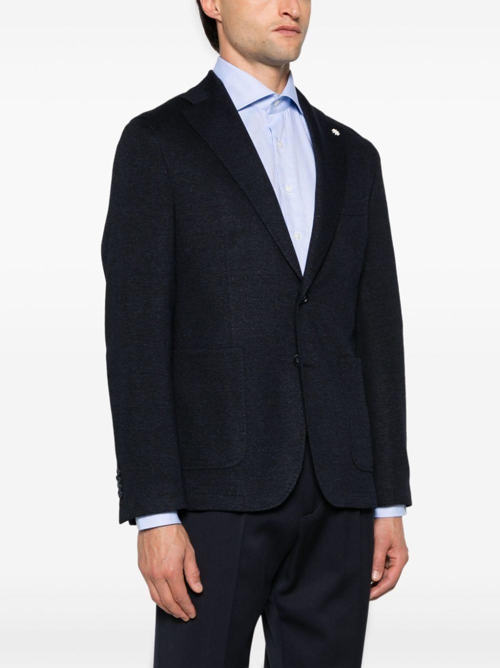 Blazer blu micro texture con spilla logo