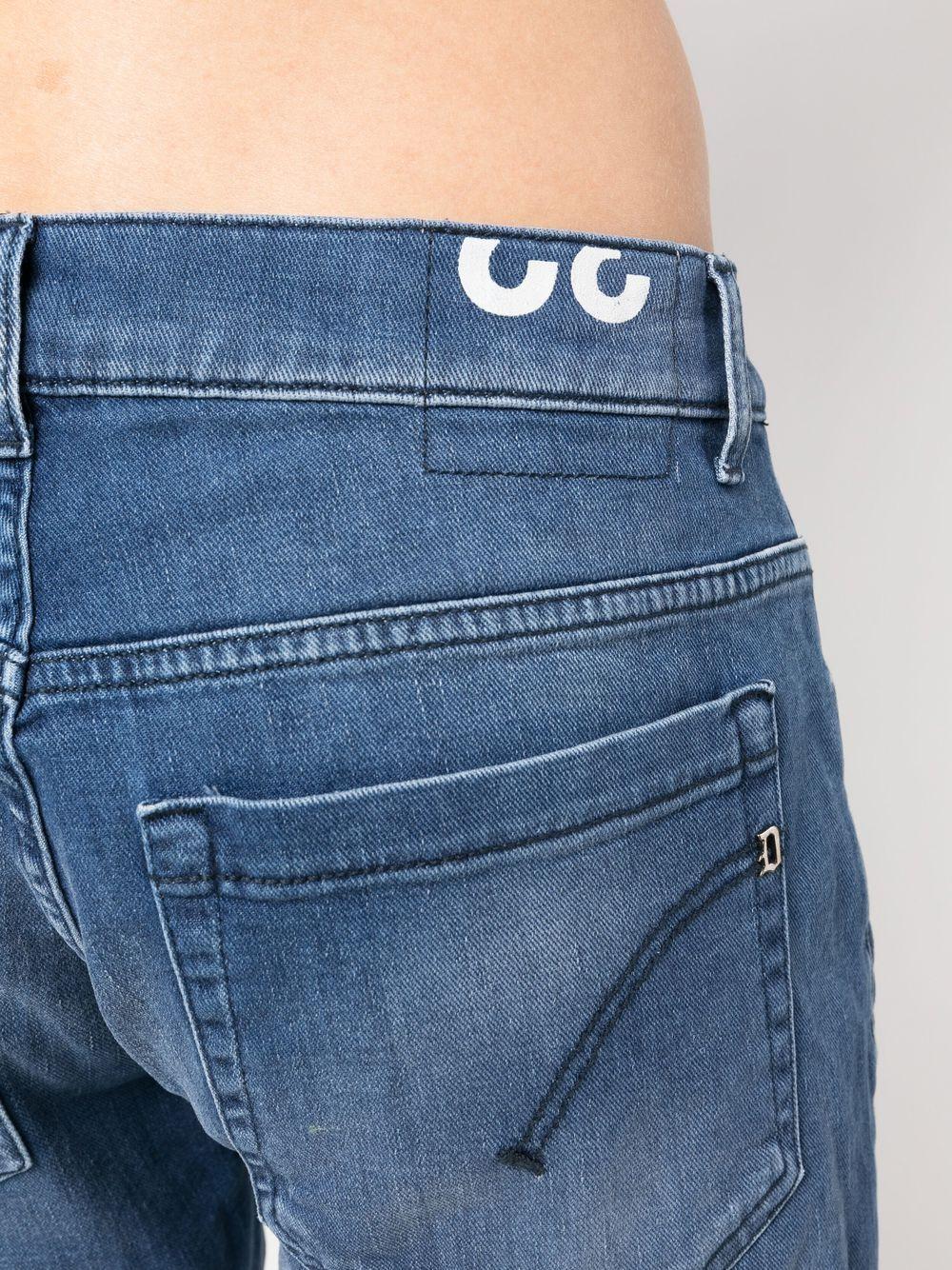 Jeans blu con schizzi di pittura