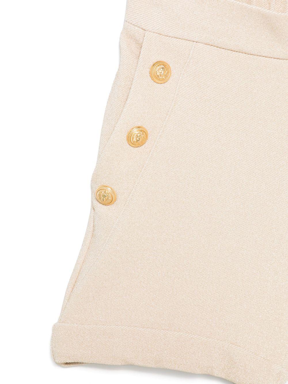 Short beige elasticizzato con bottoi oro