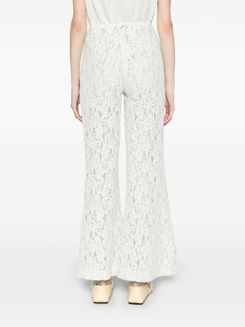 Pantaloni flare in pizzo floreale verde acqua
