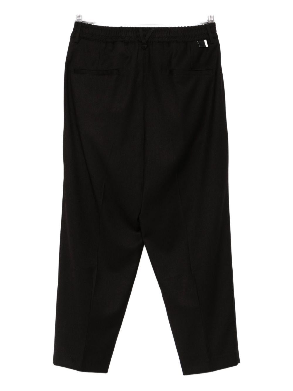 Pantaloni neri a gamba ampia con pieghe L1PFW25266968 D001 LOW BRAND