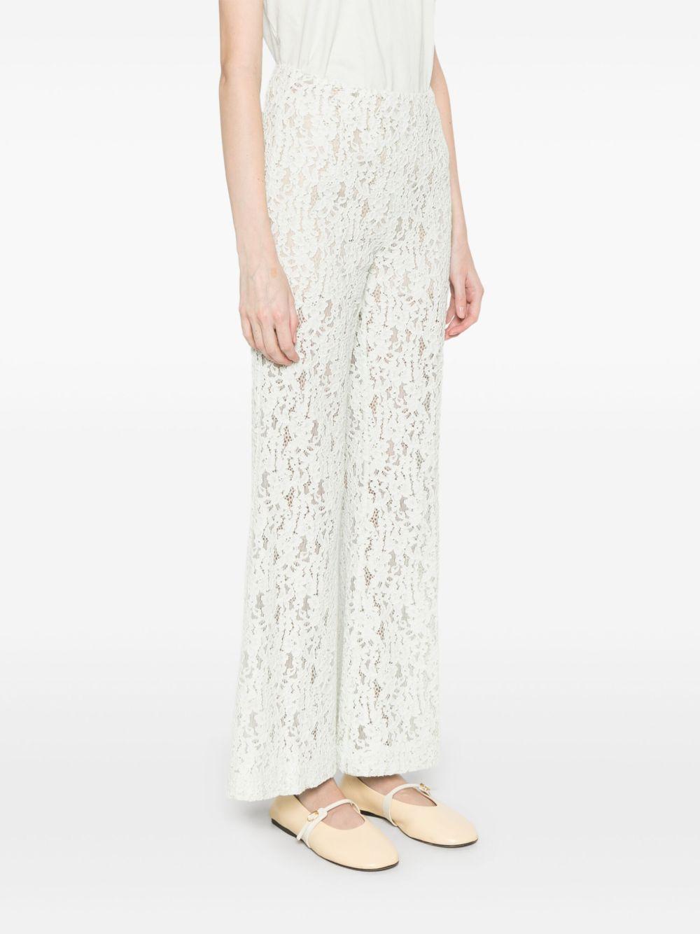 Pantaloni flare in pizzo floreale verde acqua