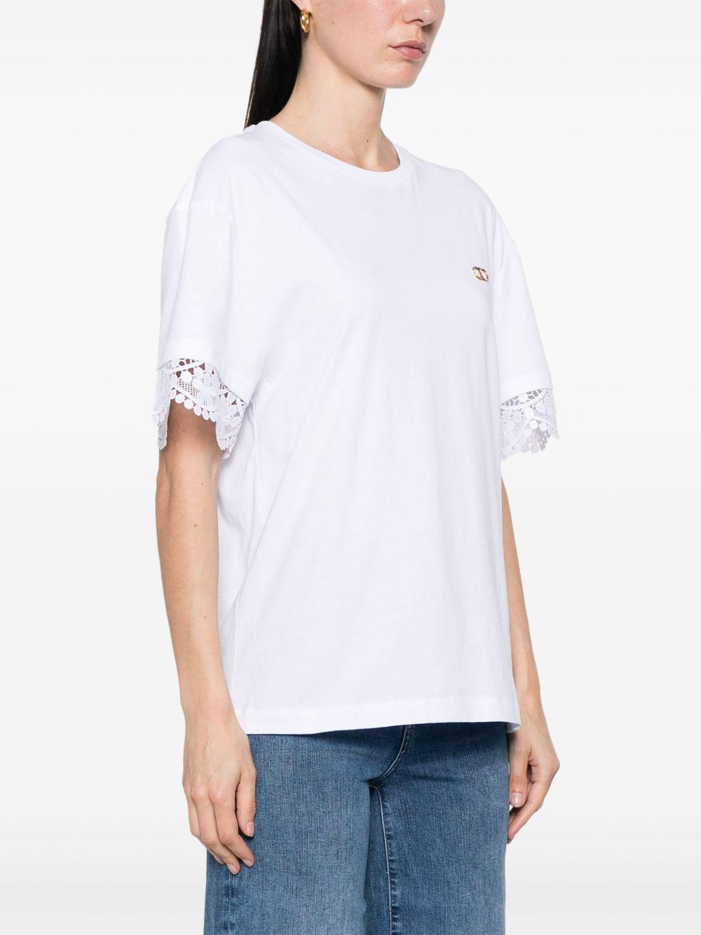 T-shirt bianca con orli ricamati