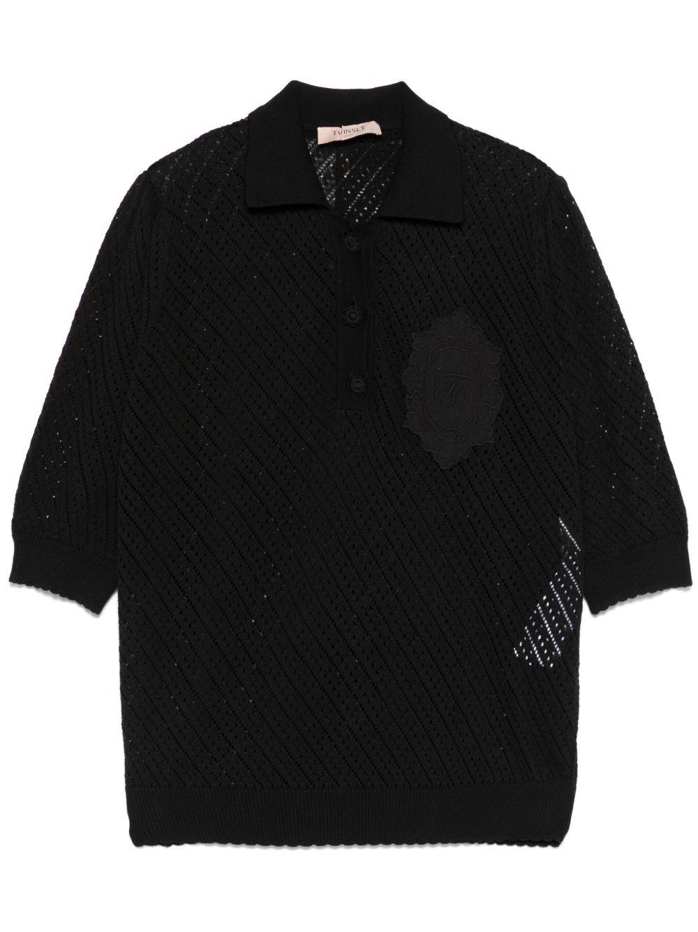 Maglia nera traforata con ricamo