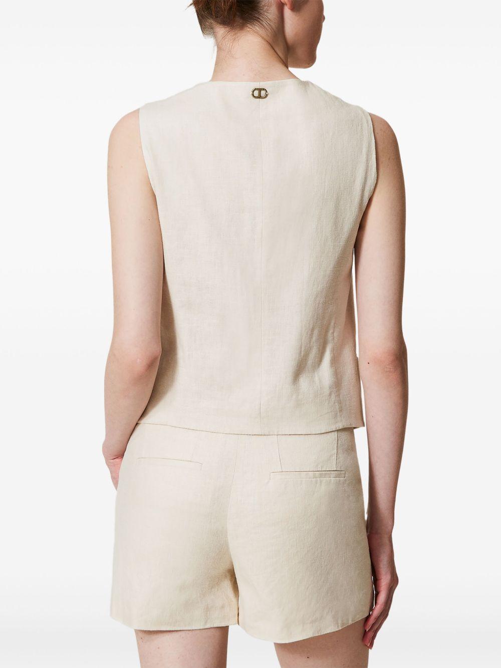 Short madreperla in lino ricamato