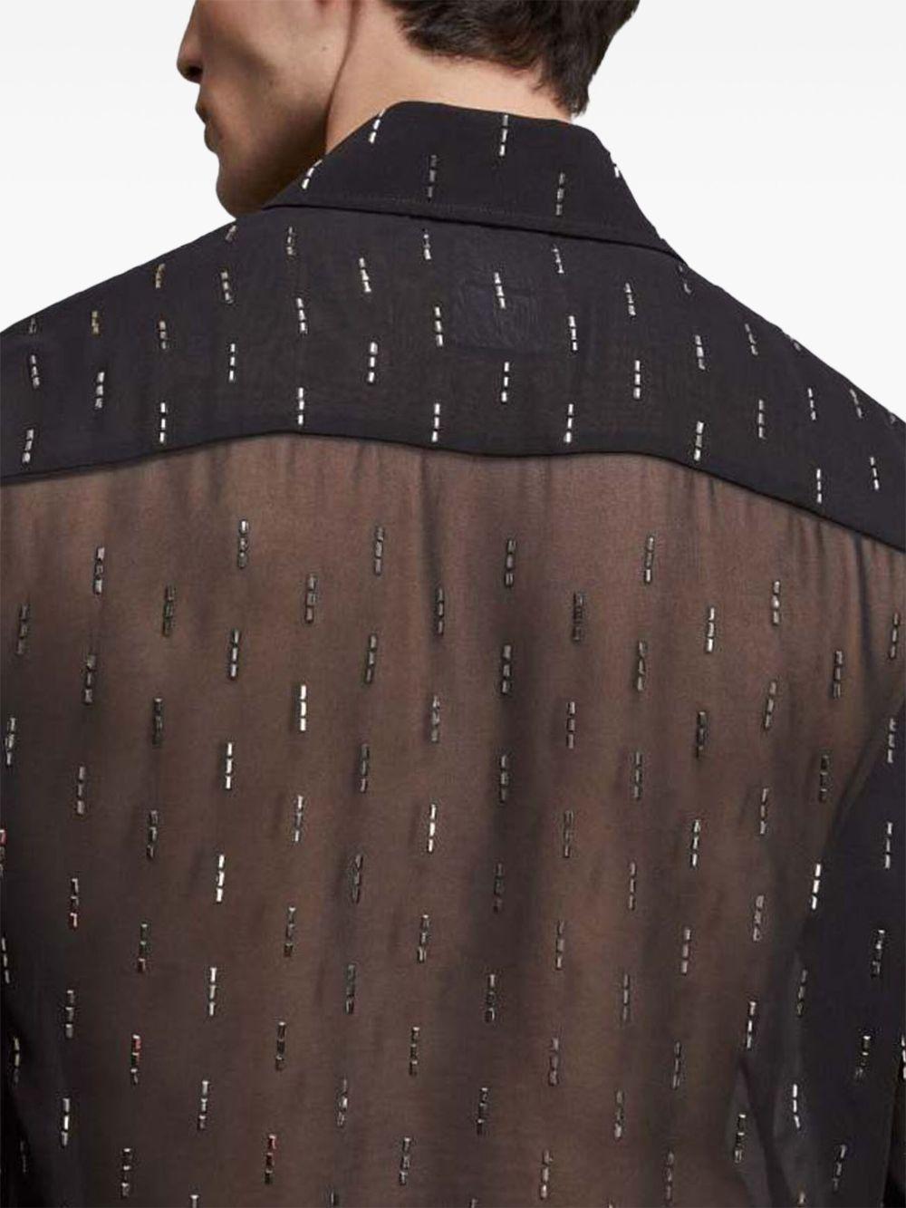 Camicia nera semitrasparente con strass