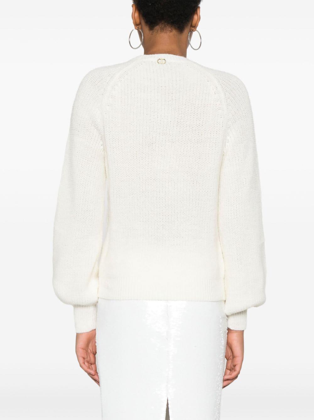 Maglione bianco con ricamo floreale