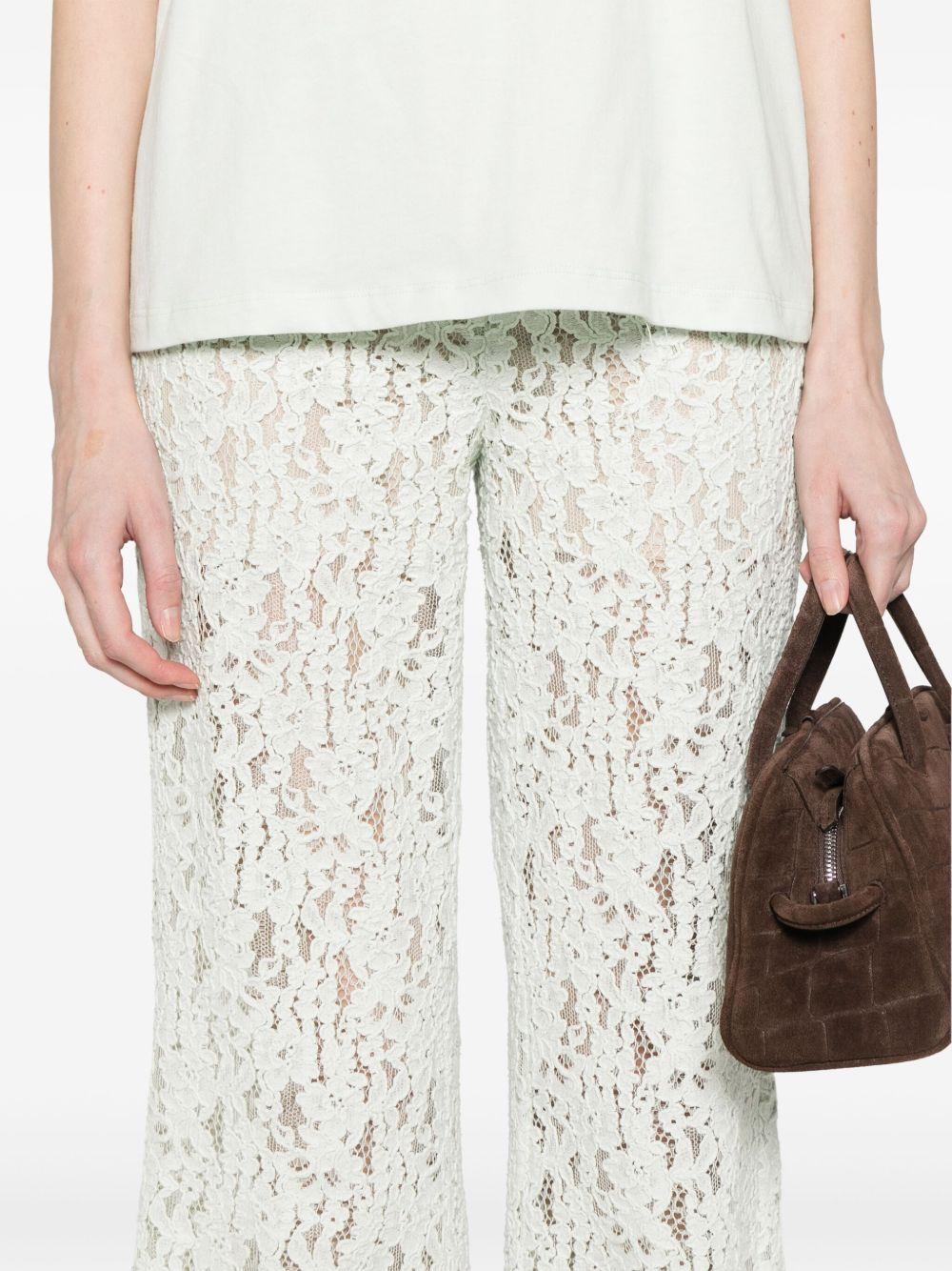 Pantaloni flare in pizzo floreale verde acqua