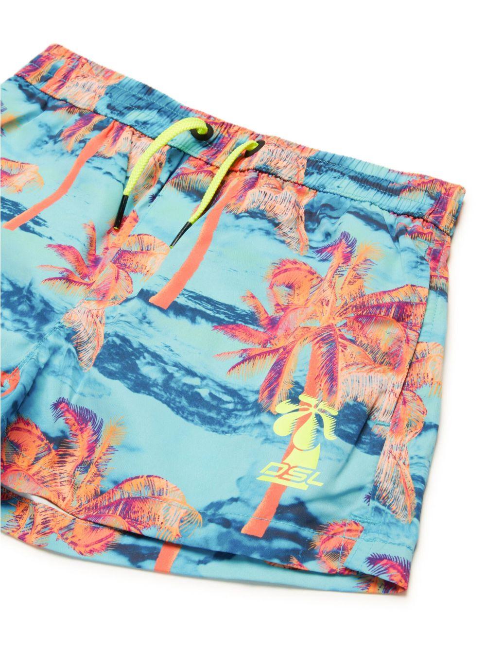 Costume azzurro con fantasia stampata palme