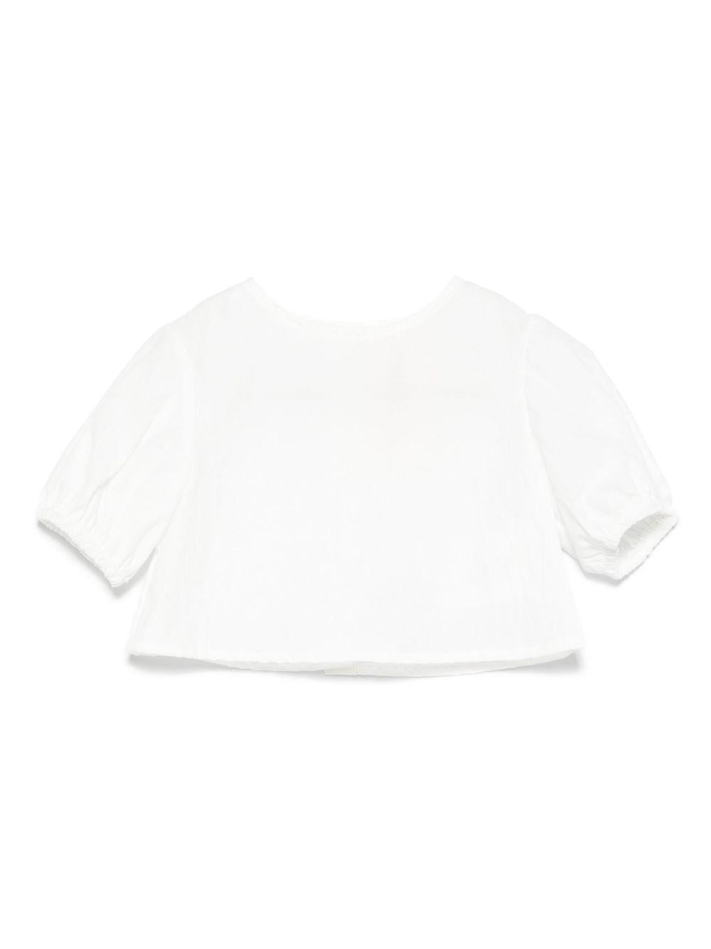 Top bianco neonata con chiusura bottoni