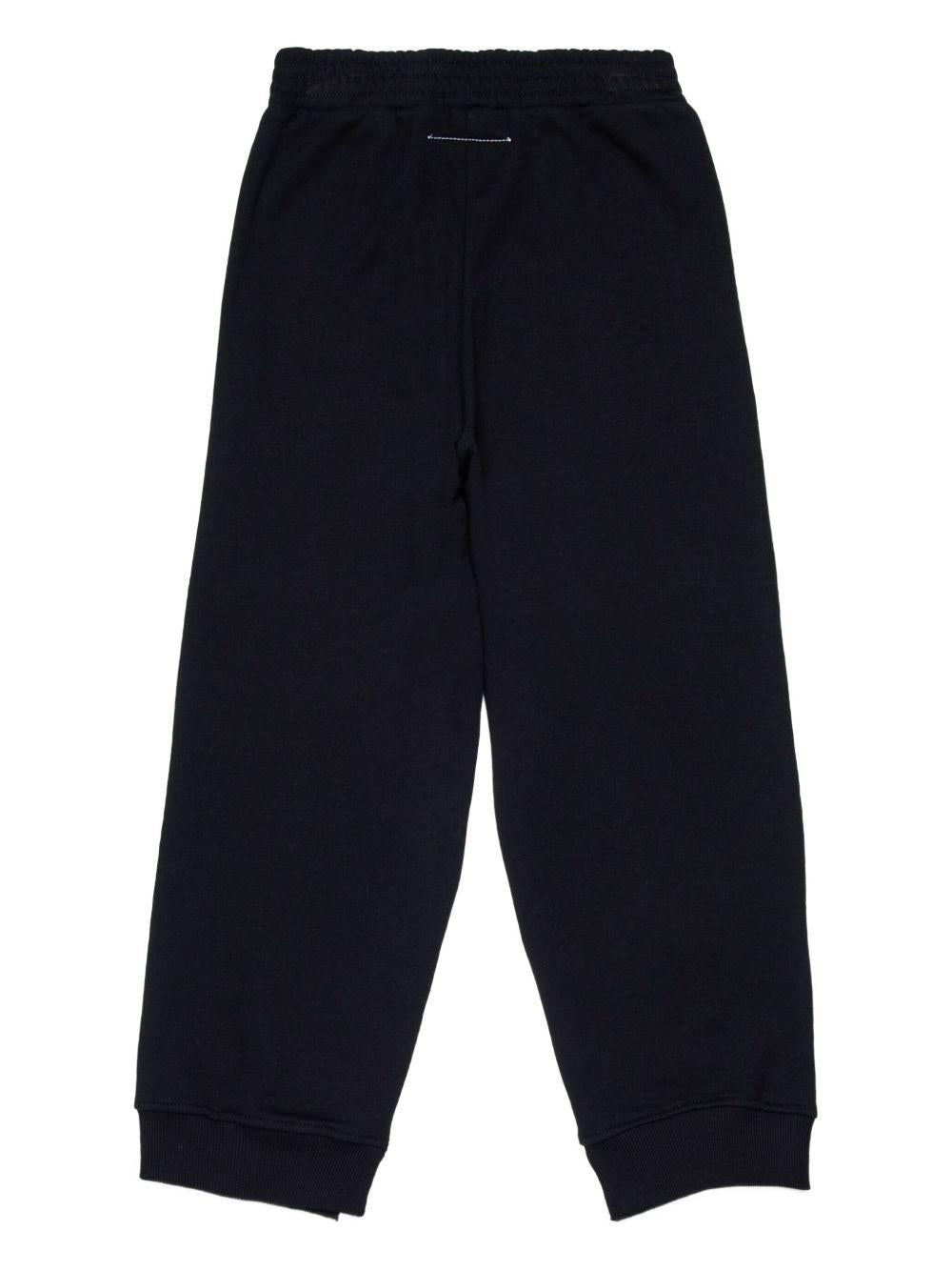 Pantaloni neri sportivi con motivo numeri e vita elasticizzata M60895MM02X M6900 MM6 MAISON MARGIELA KIDS