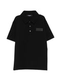 Polo in cotone con logo patch