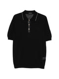 Polo in cotone con ricami traforati