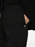 Pantalone con piccolo logo nero
