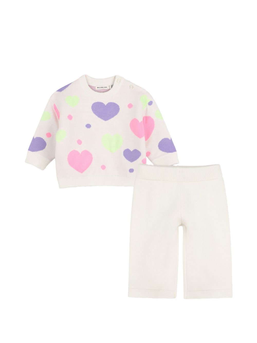 Completo in maglia due pezzi con maglione a maniche lunghe con cuori in jacquard, scollo tondo, chiusura con bottoni sulla spalla. Ampio pantaloni in maglia, vita elastica. U22611 121 BILLIE BLUSH KIDS 