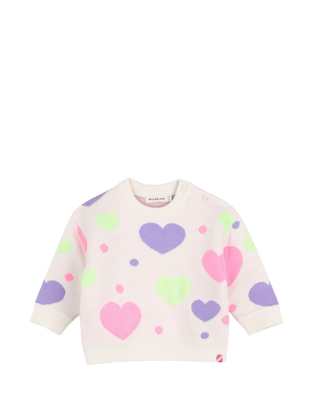 Completo in maglia due pezzi con maglione a maniche lunghe con cuori in jacquard, scollo tondo, chiusura con bottoni sulla spalla. Ampio pantaloni in maglia, vita elastica. U22611 121 BILLIE BLUSH KIDS 