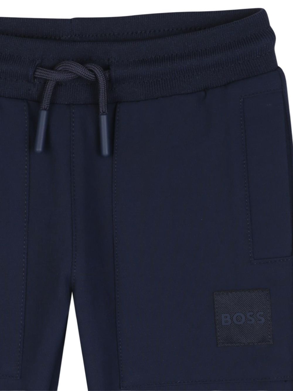 Jogging pantaloni in peachy wavy satin polyester e elastane. Vita elastica con coulisse. Two side tasche. Tone-on-tone boss badge in high definition sul davanti. J53471 849 BOSS KIDSWEAR 