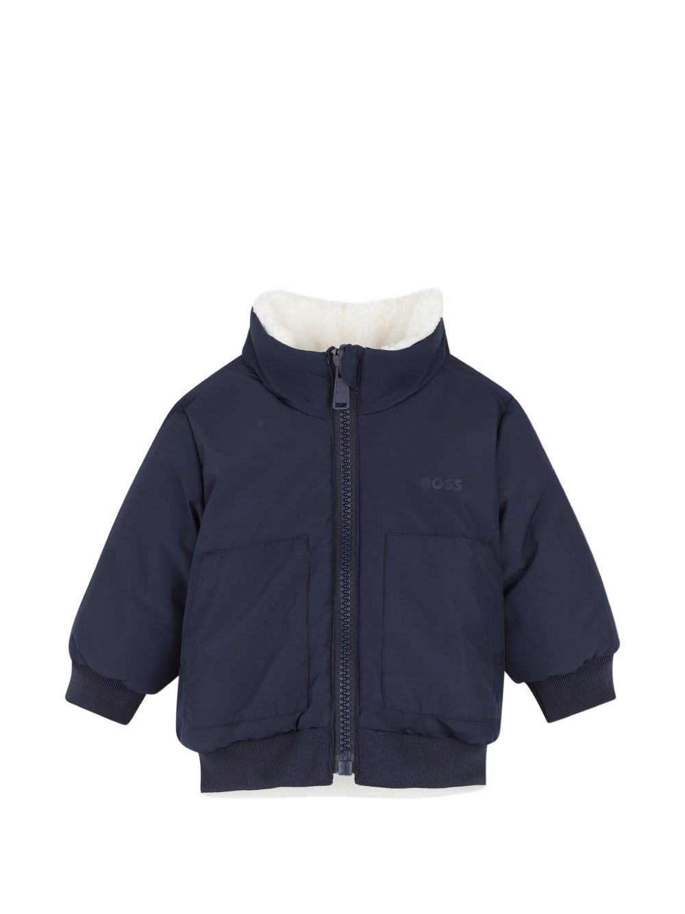 Reversible piumino. One side in sherpa con chiusura con zip, boss badge sul chest, e two side tasche. Other side in nylon con chiusura con zip, boss logo sul chest, e two patch tasche sul davanti. J53505 120 BOSS KIDSWEAR 