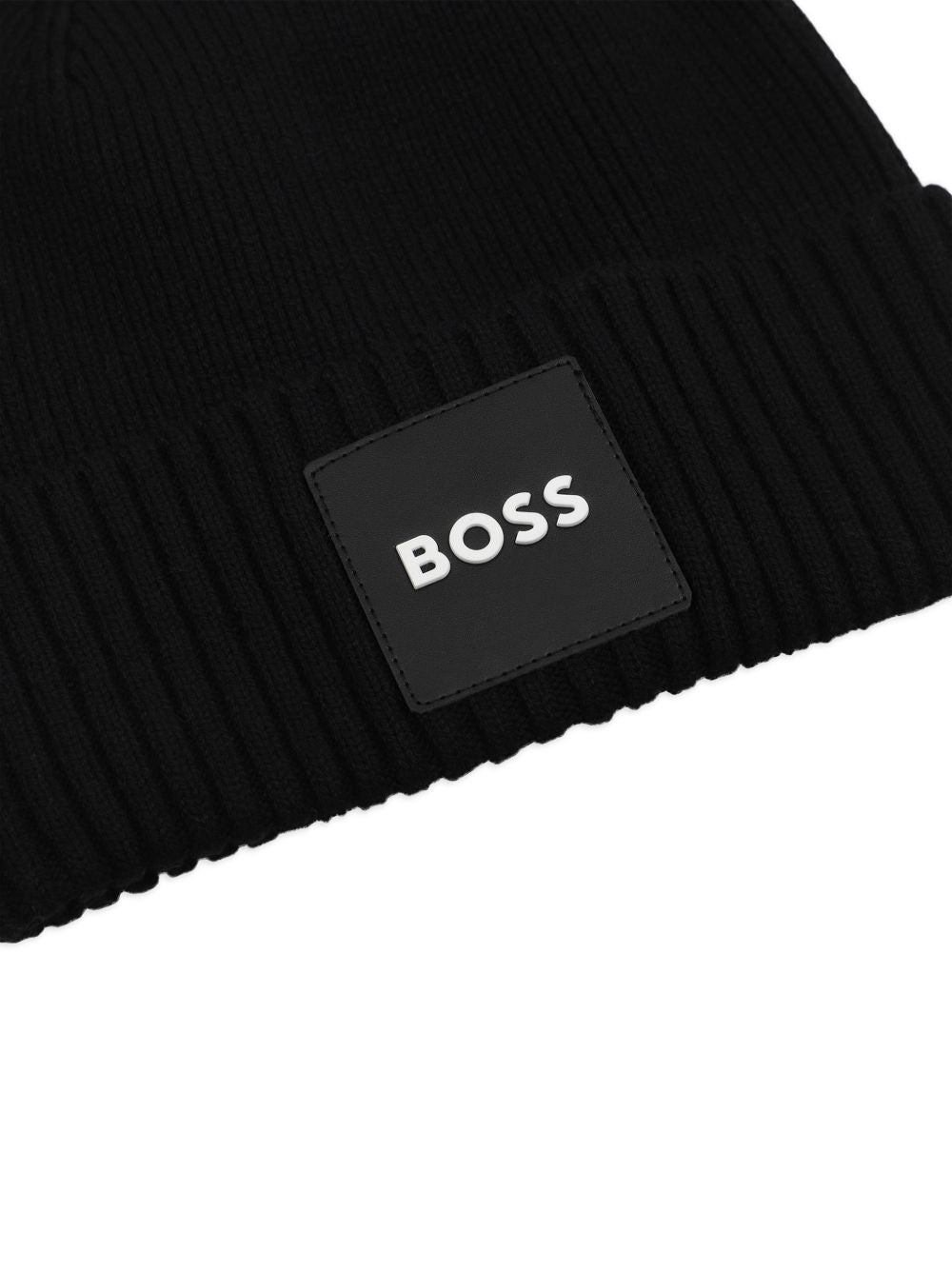 Knit beanie con branded badge. Mainly made in cotton, co/pa. Matched snood j53590 J53583 09B BOSS KIDSWEAR 