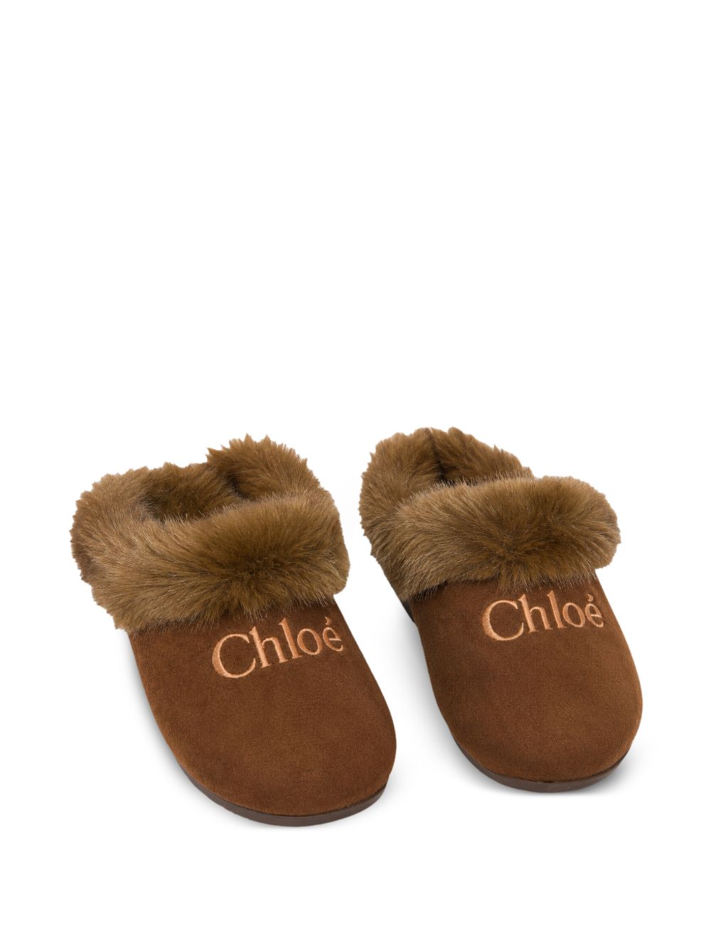 Mule in goat split leather (mineral tanning) e eco-pelliccia, faux shearling fodera, insock in cork e faux shearling, rubber outsole, ricamato chloe logo on davanti. Sold in a branded shoe box. Made in portugal. C21333 31F CHLOE KIDS 