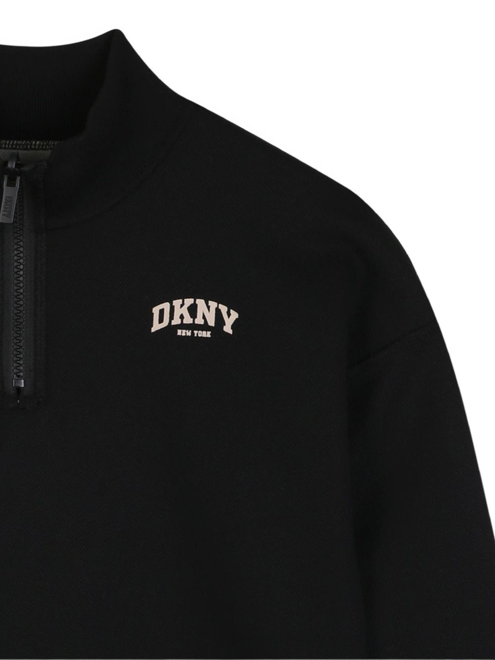 Reversible sweatshirt in doble jersey, 86% polyester 10% viscose 4% elastane, con high collar. One black side in jersey piqué effect con printed dkny logo at chest. Other side in beige jersey con dk logo in flocking technic at chest. D62868 P90 DKNY KIDS 