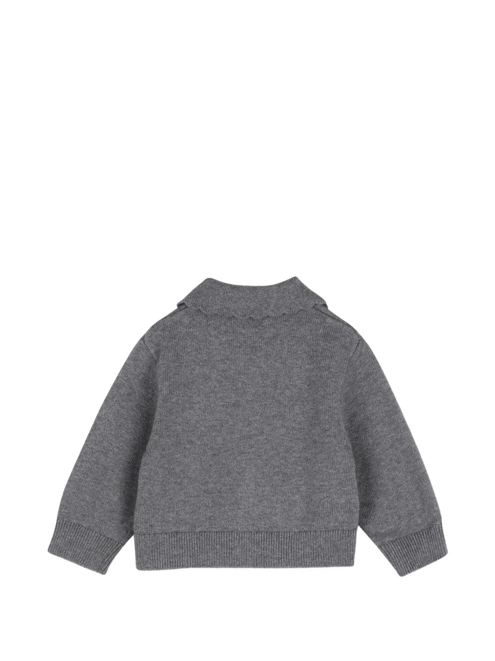 In maglia set of cardigan e pantaloni, in jersey 95% cotton e 5% cashmere. Cardigan, middle davanti tone on tone buttonned. Color contrasted, givenchy logo ricamo at davanti chest. Pantaloni con vita elastica e color contrasted givenchy logo ricamo. H31295 A47 GIVENCHY KIDS 