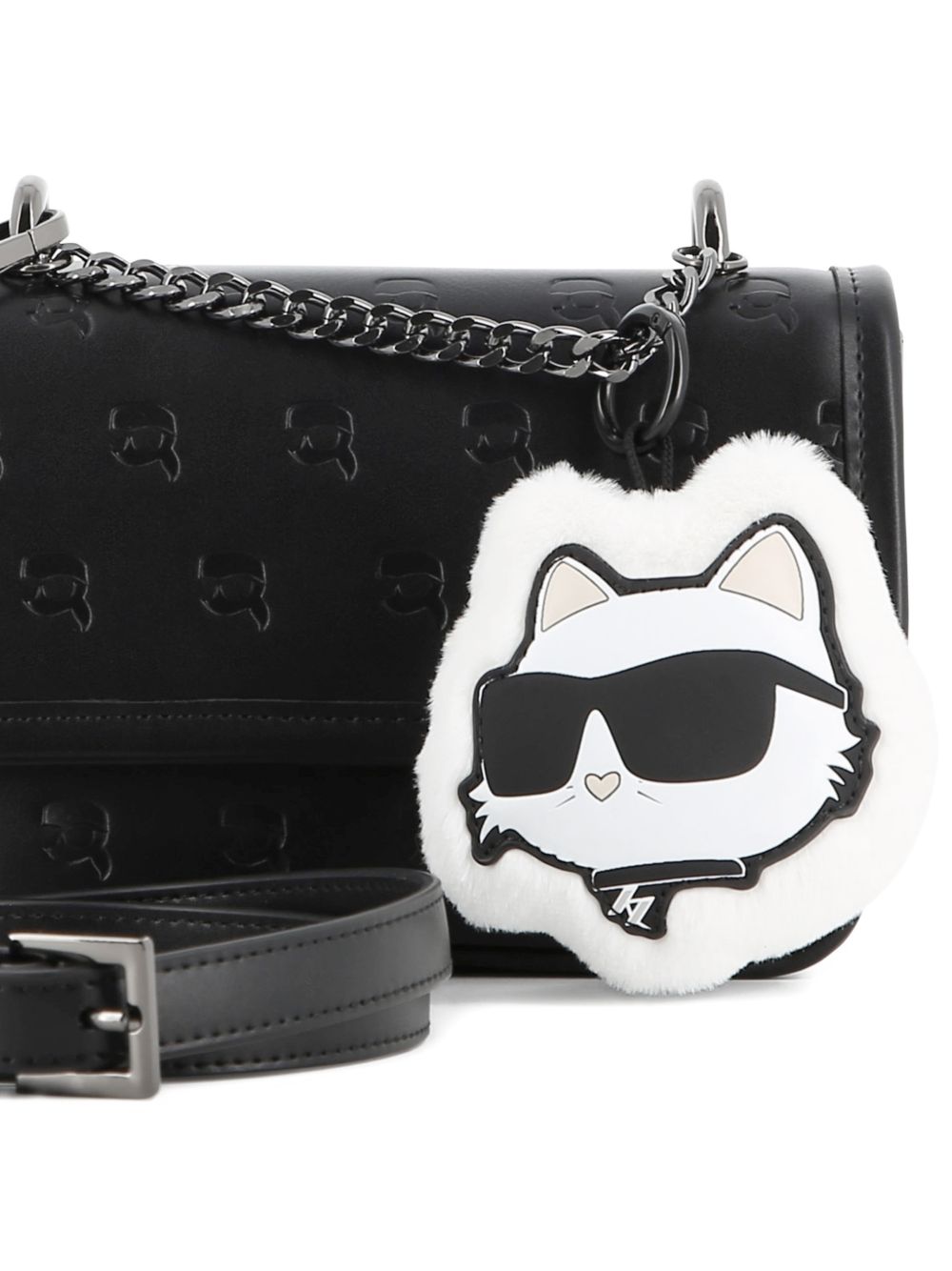 Handbag in simili con karl all-over hollow. Removable eco-pelliccia choupette key charm. Removable e regolabile strap in simili. Short handle in metal chain. Magnet chiusura. Branded fodera. Metal plate on retro. Dimensions : 12x18x5cms Z31458 09B KARL LAGERFELD KIDS 