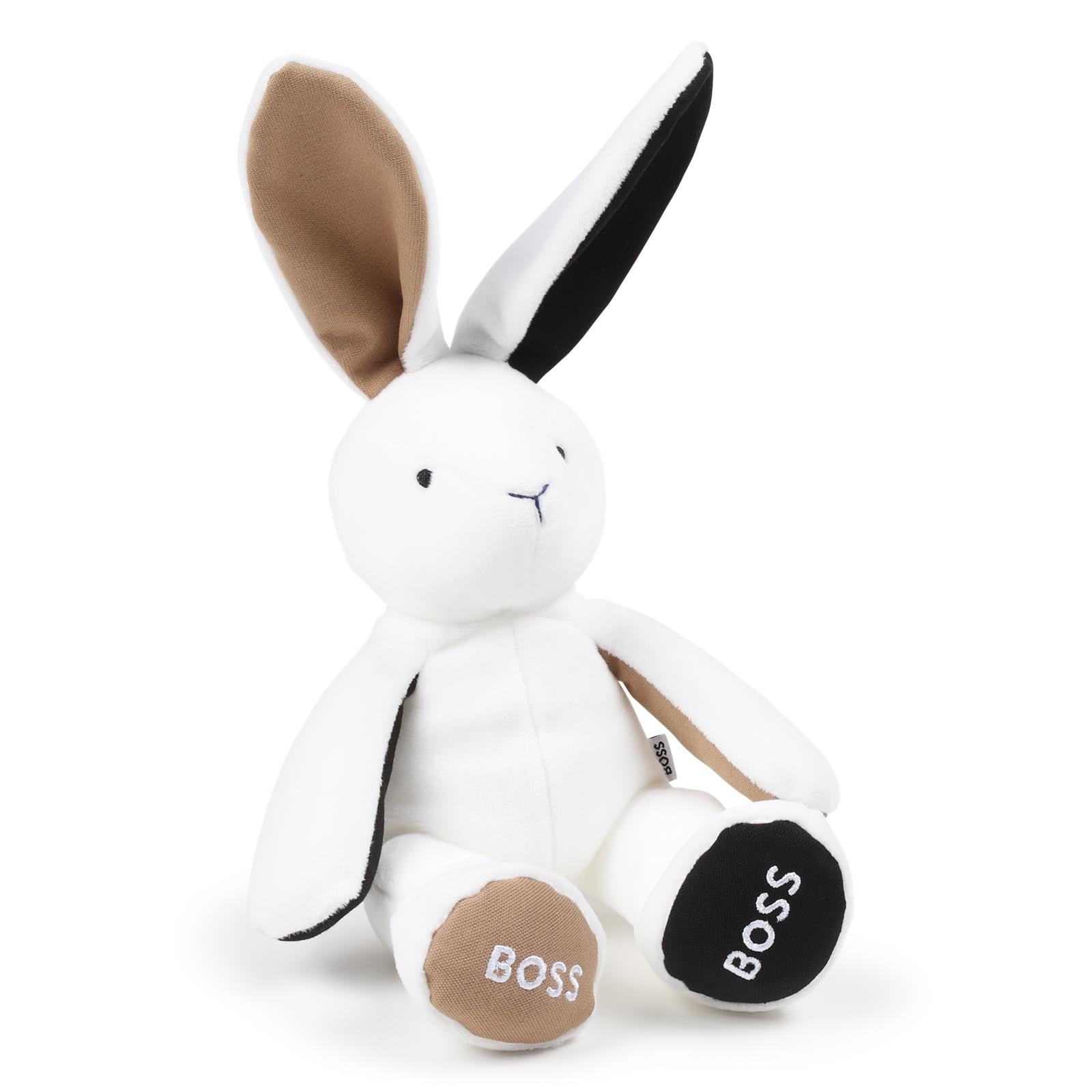 Polyester eco-pelliccia cuddly toy, branded embroideries under feet, branded woven label sul retro. Dimensions : 40 cm length (standing position e ears up) 17 cm height (sitting position e ears down). Sold in a zipped pouch J51013 10P BOSS KIDSWEAR 