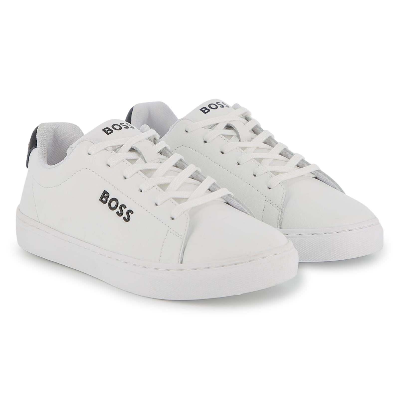 Sneakers in cow nappa leather e textile. Brand printed sul side, al retro e sul tongue. Lace up chiusura. Fodera in textile. Insole in breathable microfiber. Tpr outsole. Mineral tanning. J53248 10P BOSS KIDSWEAR 