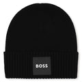 Knit beanie con branded badge. Mainly made in cotton, co/pa. Matched snood j53590