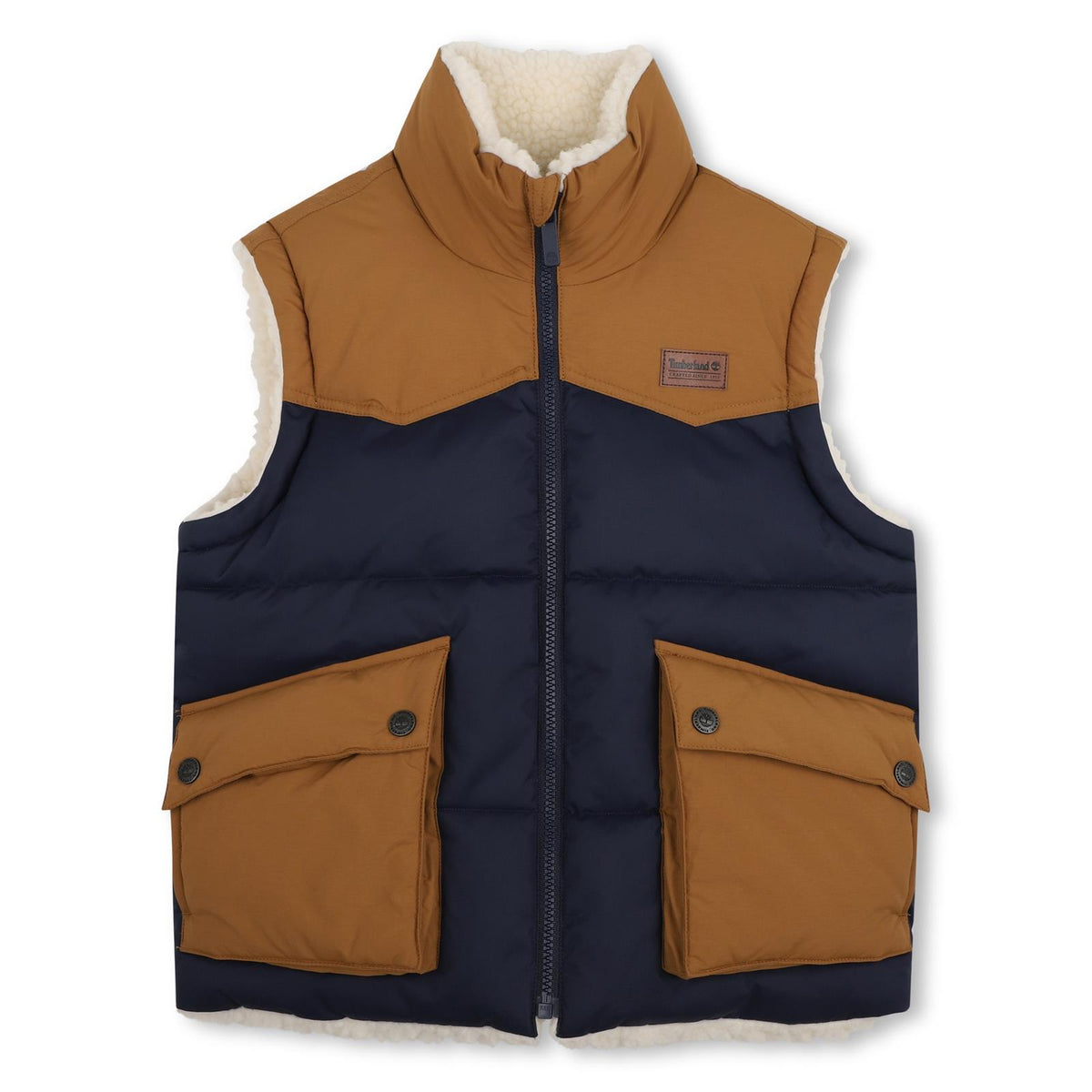 Reversible senza maniche piumino. One side in 100% polyester water repellent twill, bicolor yokes, davanti flap tasche, printed logo on paper label on chest. Other side in 100% polyester faux shearling, side tasche, ricamato logo sul retro. *reversib T61059 849 TIMBERLAND KIDS 