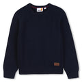 85% cotton / 15% wool in maglia felpa, different knit stitch pattern on sides, printed logo on paper label at fondo.