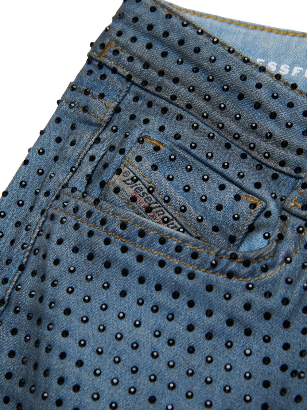 Blue jeans with black rhinestones all-over