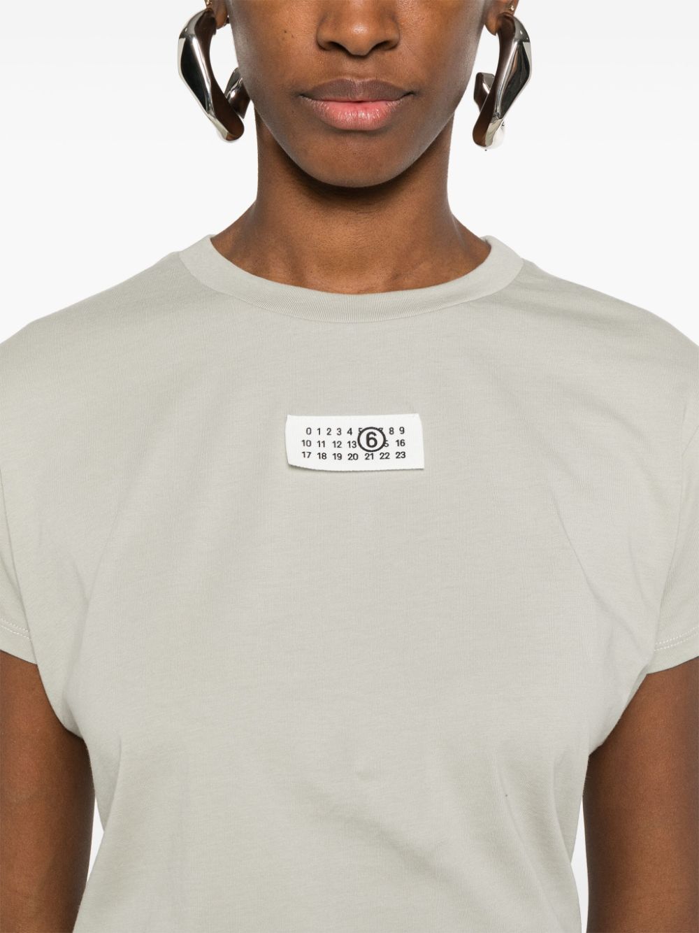 Sage green t-shirt with number logo label